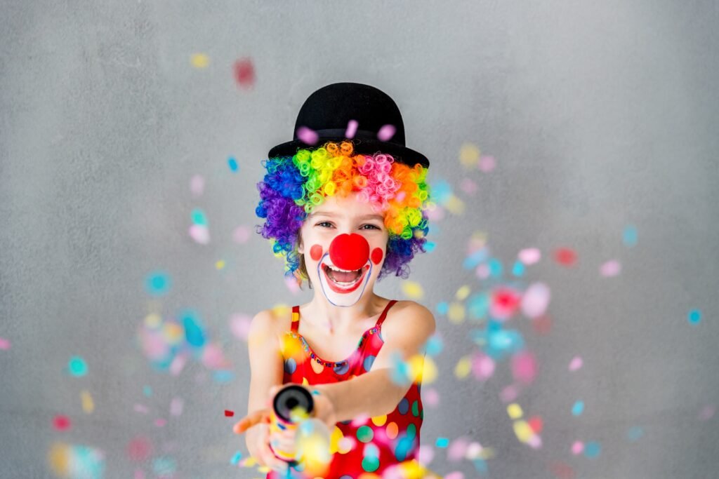 bang-funny-kid-clown-playing-at-home-child-shooting-party-popper-confetti-1-april-fool-s-day-concept