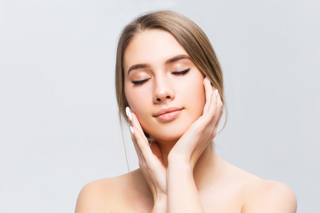 beautiful-face-of-young-adult-woman-with-clean-fresh-skin-isolated-on-white-min