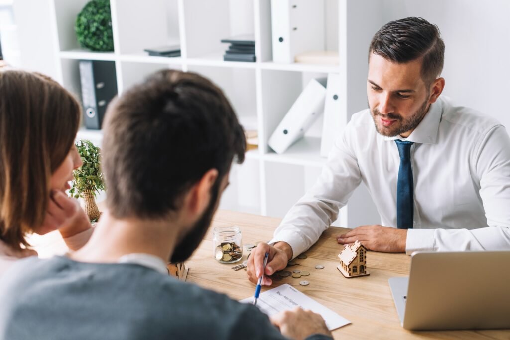 couple-consulting-with-real-estate-agent